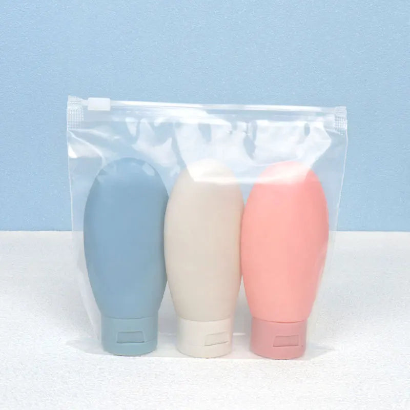 Flacons de voyage souples - lot de 3 flacons bleu, beige et rose