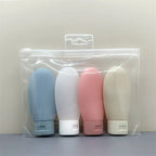 Flacons de voyage souples - lot de 4 flacons dans leur trousse transparente